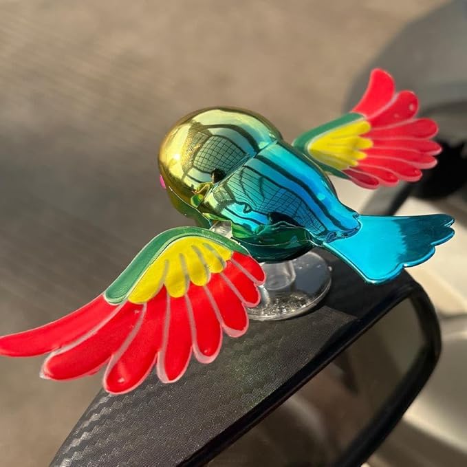 Car Dashboard Bird Toy with Rotating Wings and Suction Base in multicolor