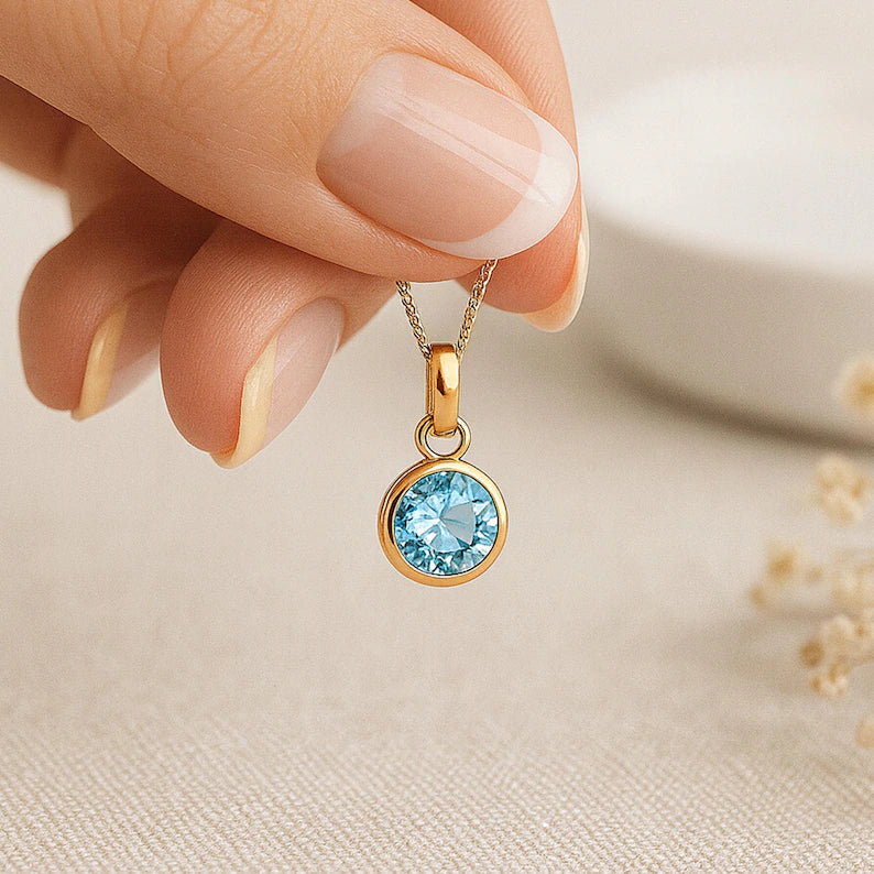 Topaz (Blue) Birthstone Pendant with gold plated chain included
