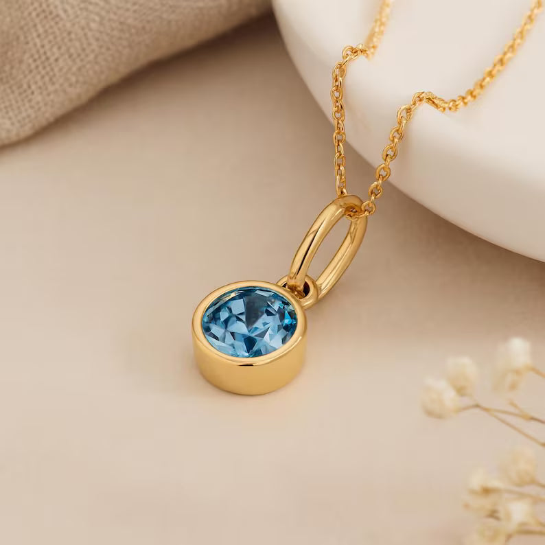 Topaz (Blue) Birthstone Pendant with gold plated chain included
